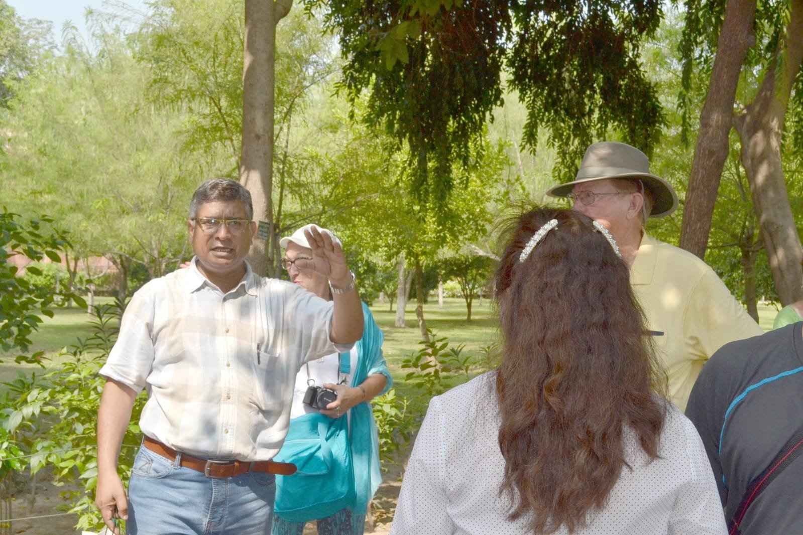 Professional Tour Guide in India helping foreign tourists explore historical monuments